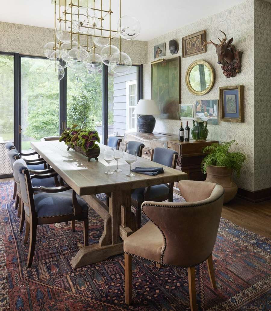 Collected Lodge dining room with original art and antiques by Twig and Trove Interiors