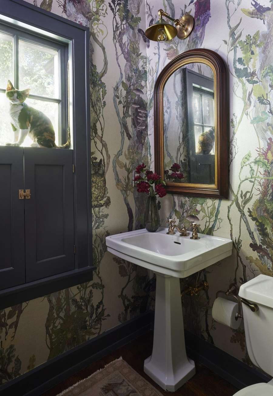 Powder room with scenic wallpaper at the Collected Lodge by Twig and Trove Interiors