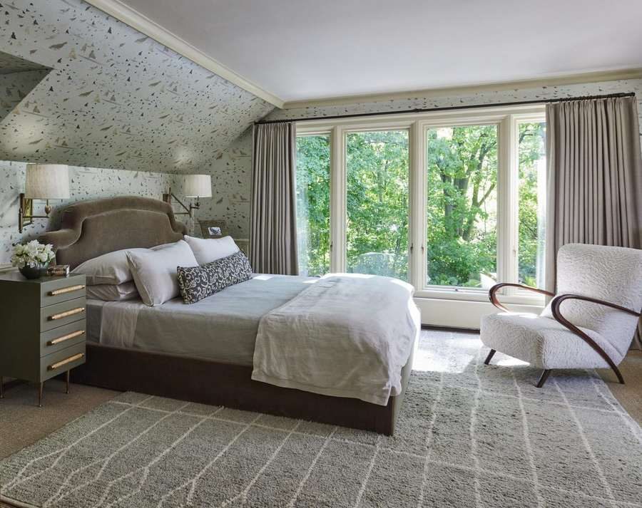 Collected Lodge primary bedroom with mohair headboard and bird motif wallpaper by Twig and Trove Interiors